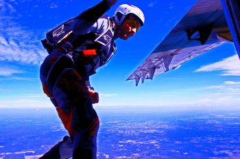A Skydiver Exiting a Twin Otter Aircraft
